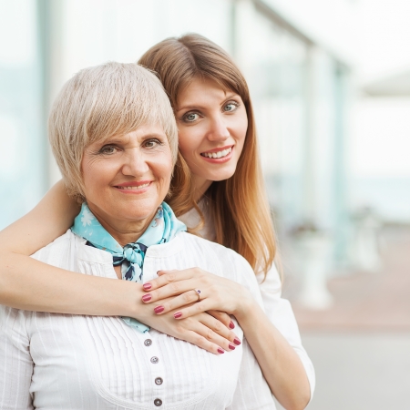 Adult mother with her daughter huggingの写真素材