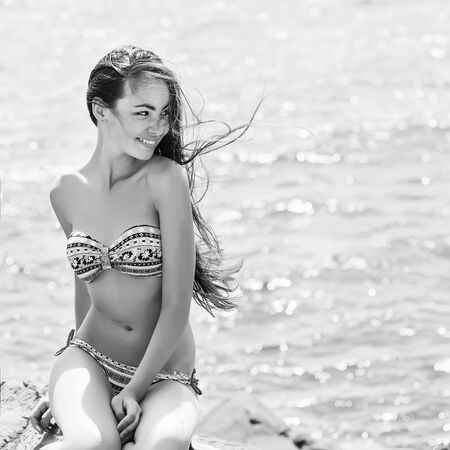 Beach woman laughing having fun in summer vacation holidaysの写真素材