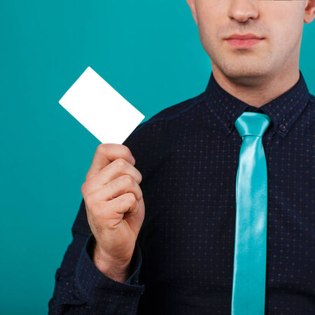 Part of body of business man who takes out business card from the pocket of business suit, copyspaceの写真素材