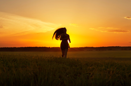 Beauty Romantic Girl Outdoors at sunsetの写真素材