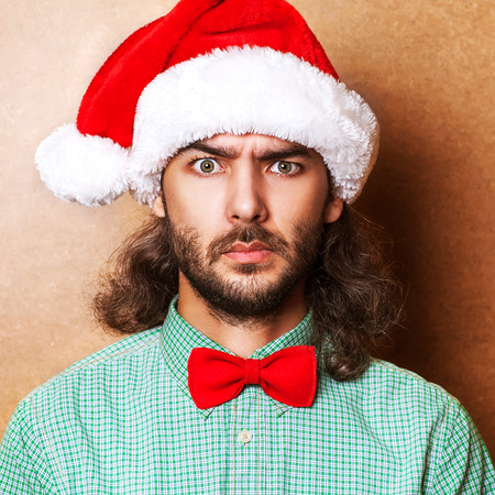 handsome man dressed as Santa Claus. emotional portrait, hipster Style.の写真素材