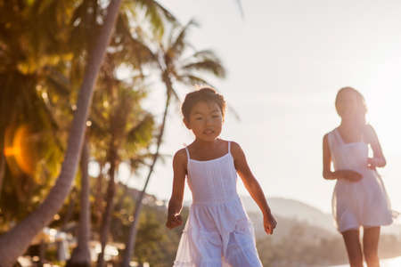 mother and daughter happy in love at sunsetの写真素材