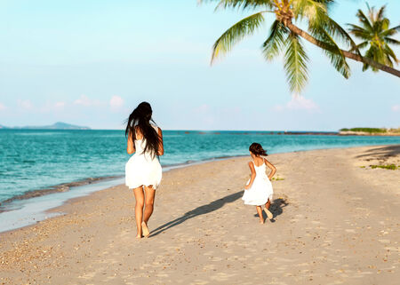 mother and daughter happy in love at sunsetの写真素材