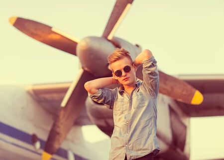 fashion man near helicopters at the airportの写真素材