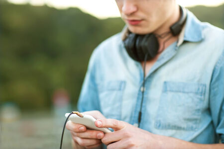 man listens to the player on the street