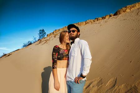 happy couple in love on the sand dunes, concept of Valentine's Dayの写真素材