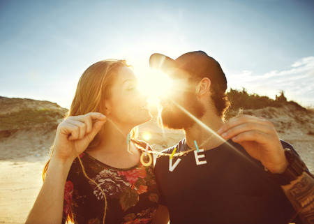 happy couple in love on the sand dunes, concept of Valentine's Dayの写真素材