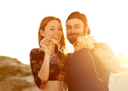 happy couple in love on the sand dunes, concept of Valentine's Day