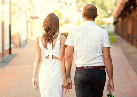 meeting a guy and a girl, walking around the city, doing pokupui, business style, eleganceの写真素材