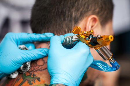 Master does a tattooの写真素材