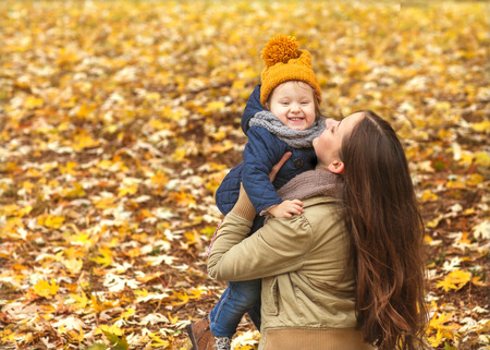 mother and daughter hugging in love playing in the park. Mothers dayの写真素材