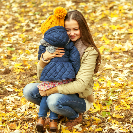mother and daughter hugging in love playing in the park. Mothers dayの写真素材