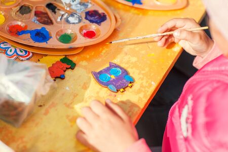 Children draw with parents paint beautiful pictures, children's creativityの写真素材