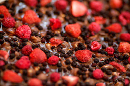 bar of chocolate with strawberries, raspberries, blueberries, Hand Madeの写真素材