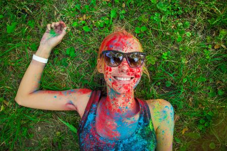girl celebrate holi festival, make selfieの写真素材