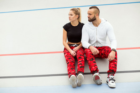 guy and girl on the street doing workoutの写真素材