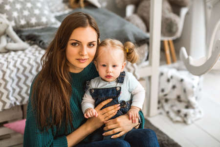 Mom and daughter are at home in the room, Mother's Day.の写真素材