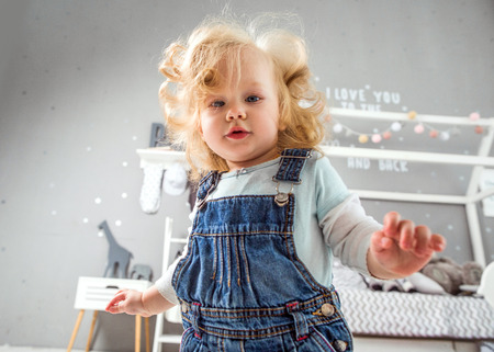 1 year old little girl playing at homeの写真素材