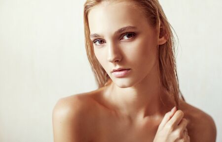 Happy beautiful girl. Nude fashion portrait of a white-haired girl.  Expressive facial expressions .Cosmetology and Spaの写真素材