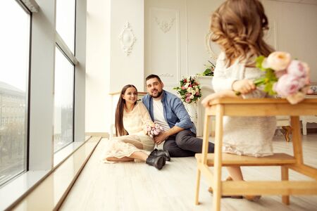 Dad gives his daughter flowersの写真素材