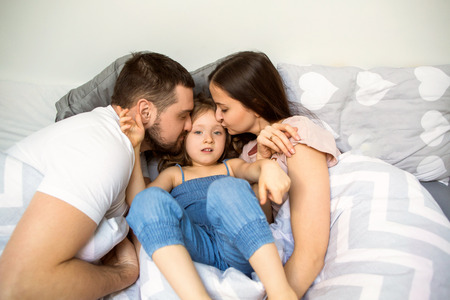 family playing happily at homeの写真素材