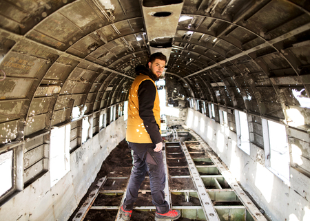 fashion guy is standing inside the plane, perspective.の写真素材