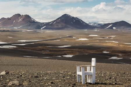 chair in the mountains with a view of the bends of the hills, Icelandの写真素材