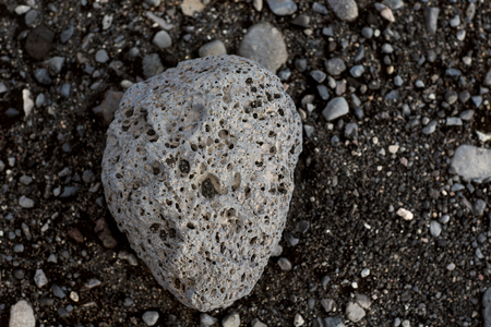 volcanic stone on black sandの写真素材