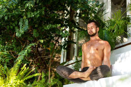 guy doing yoga in the jungleの写真素材