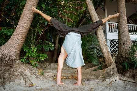 guy doing yoga in the jungle