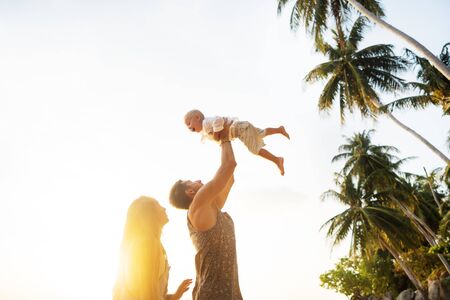 family play at sunsetの写真素材