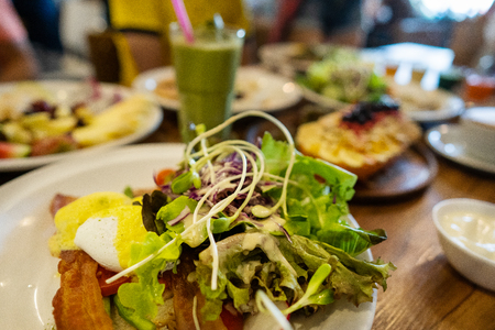 plates with dishes. stand on steel, salads, desserts and fruitsの写真素材