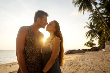 couple in love on the beach at sunsetの写真素材