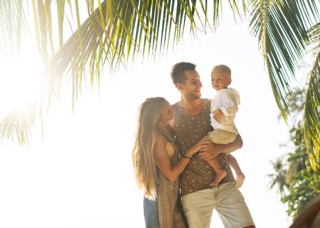 loving happy family  at sunset summerの写真素材