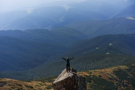 hiker girl in the mountains, freedom concept, meditation, yogaの写真素材