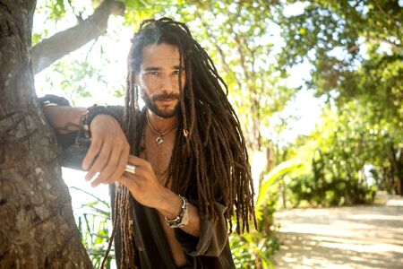 handsome guy with dreadlocks on an island in thailandの写真素材