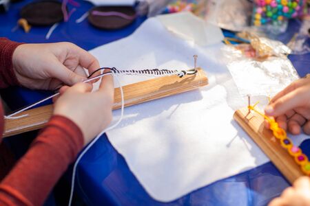 kids make braceletsの写真素材