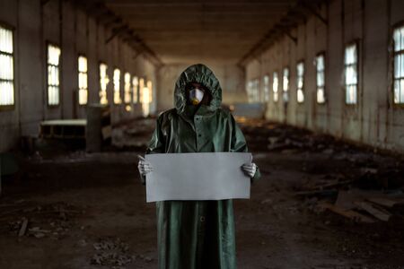 Doctor in protective suits and masks to cover the face. Isolate Holding a posterの写真素材