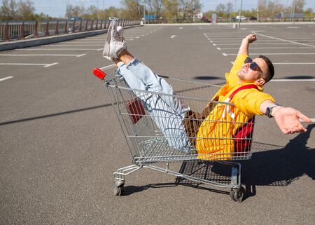 guy in the grocery cartの写真素材