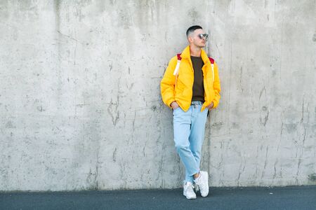 fashion guy with a backpack of products, shopping online, takeaway foodの写真素材