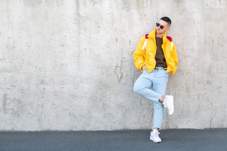 fashion guy with a backpack of products, shopping online, takeaway foodの写真素材