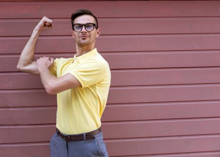 strong fashion guy athlete on a pink backgroundの写真素材