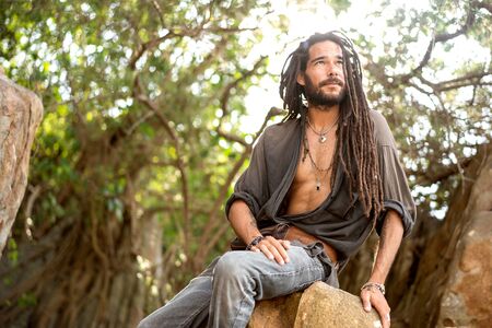handsome guy with dreadlocks on an island in thailandの写真素材