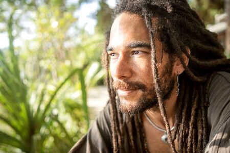 handsome guy with dreadlocks on an island in thailandの写真素材