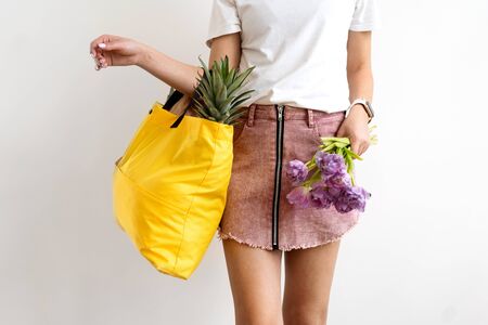 girl holding a bag with products with takeaway food. Food deliveryの写真素材