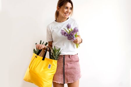 girl holding a bag with products with takeaway food. Food deliveryの写真素材