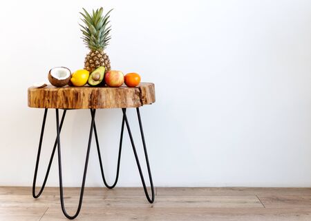 tropical fruits lie on a loft table on a white backgroundの写真素材