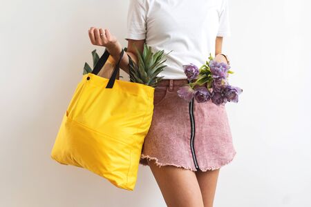 girl holding a bag with products with takeaway food. Food deliveryの写真素材