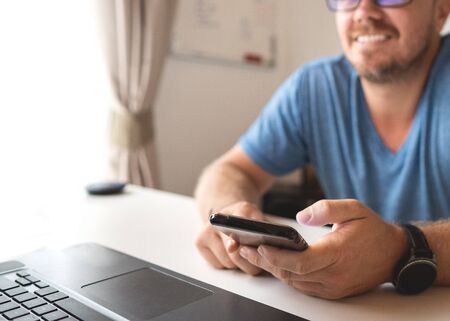 freelancer guy with laptop working at home in quarantine to coronavirus infection