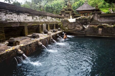 girl on holy springs in Baliの写真素材